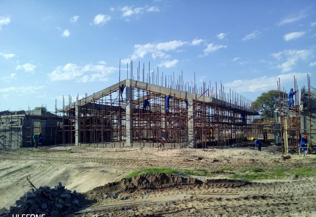 Roof structure rising over the classroom block